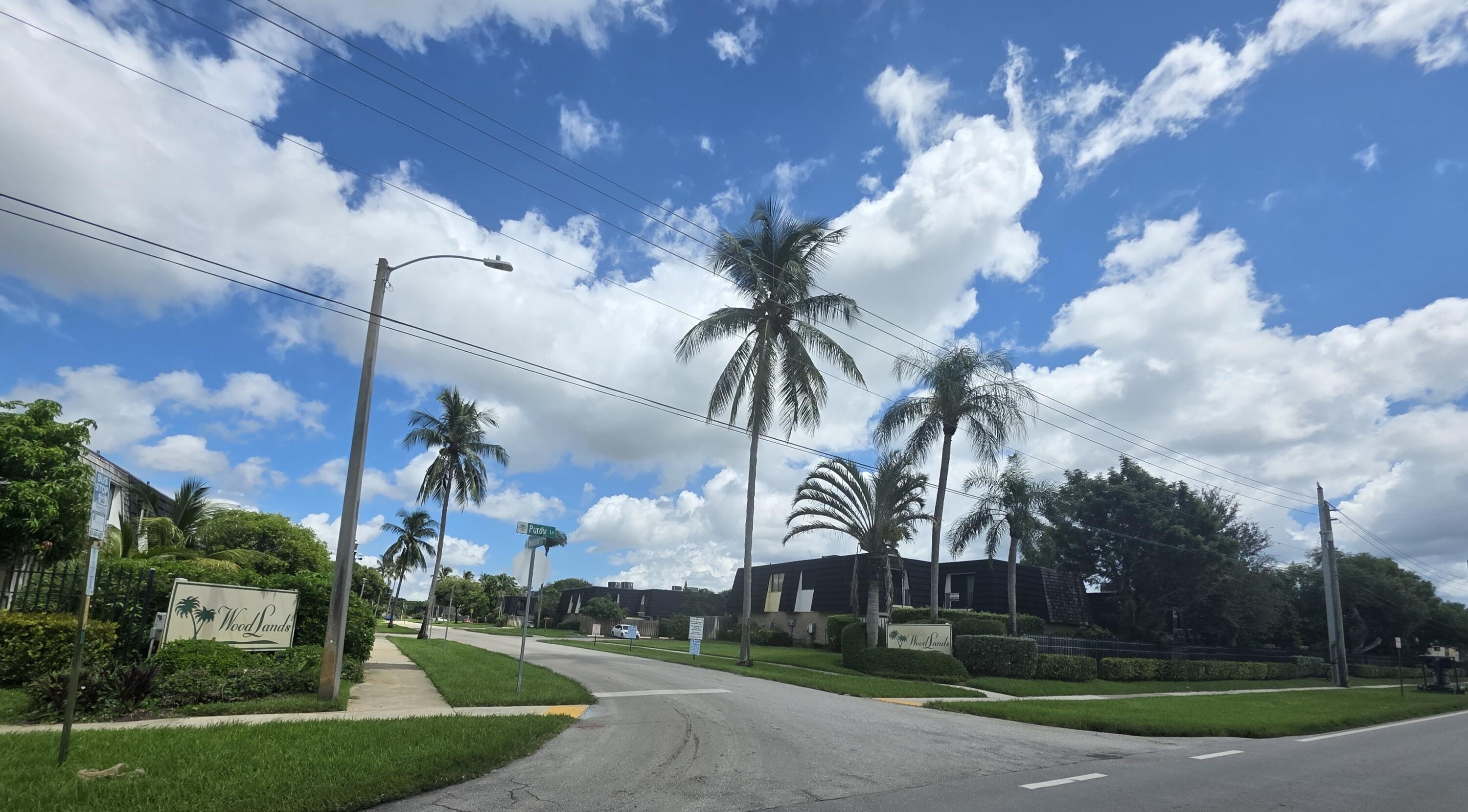218 Woodland Road Palm Springs, FL 33461 - Photo 24 of 45 a view of a yard in front of a house