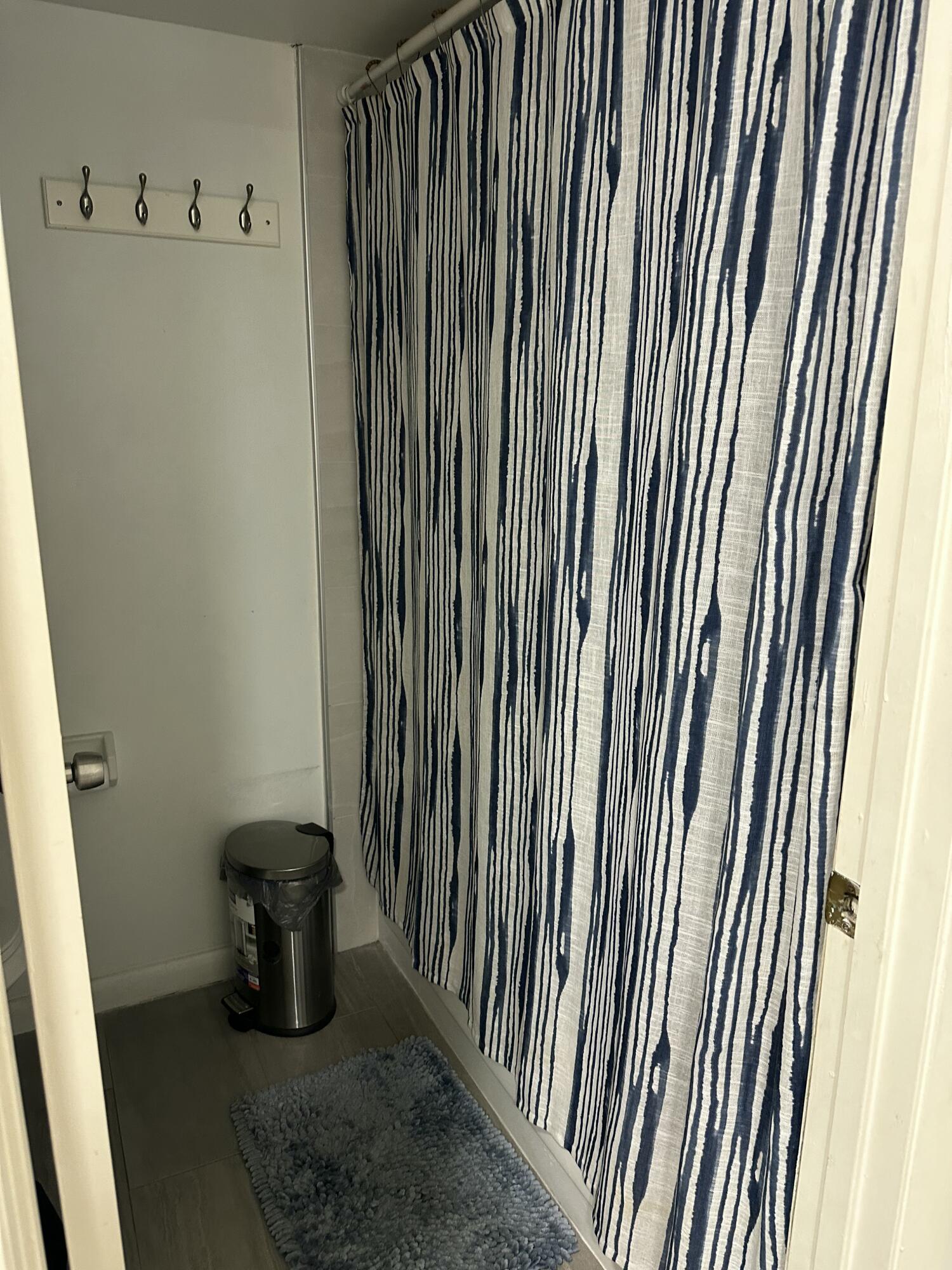 218 Woodland Road Palm Springs, FL 33461 - Photo 25 of 45 a view of a bathroom with a sink and a window