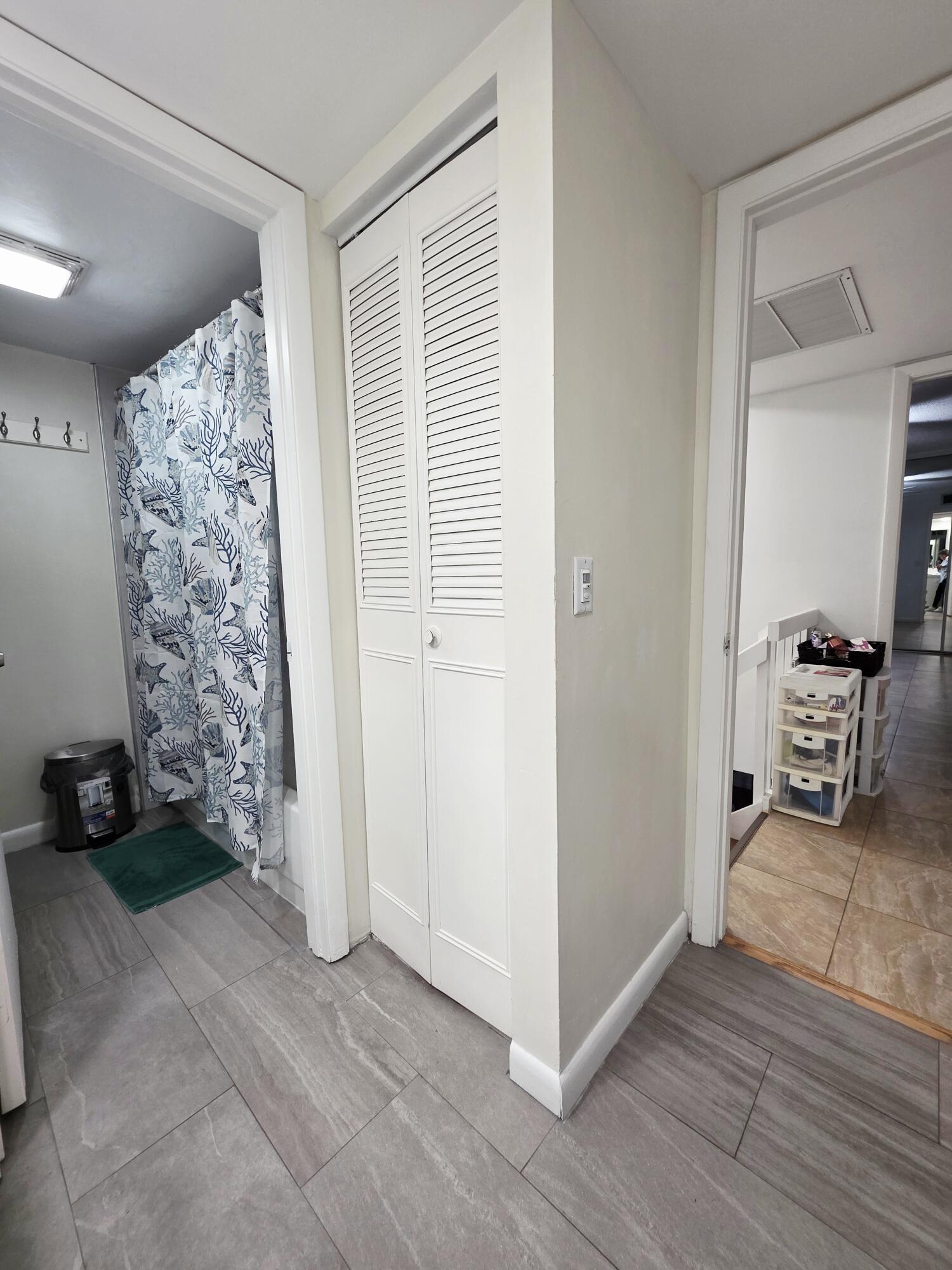 218 Woodland Road Palm Springs, FL 33461 - Photo 26 of 45 a view of a livingroom with wooden floor and a window