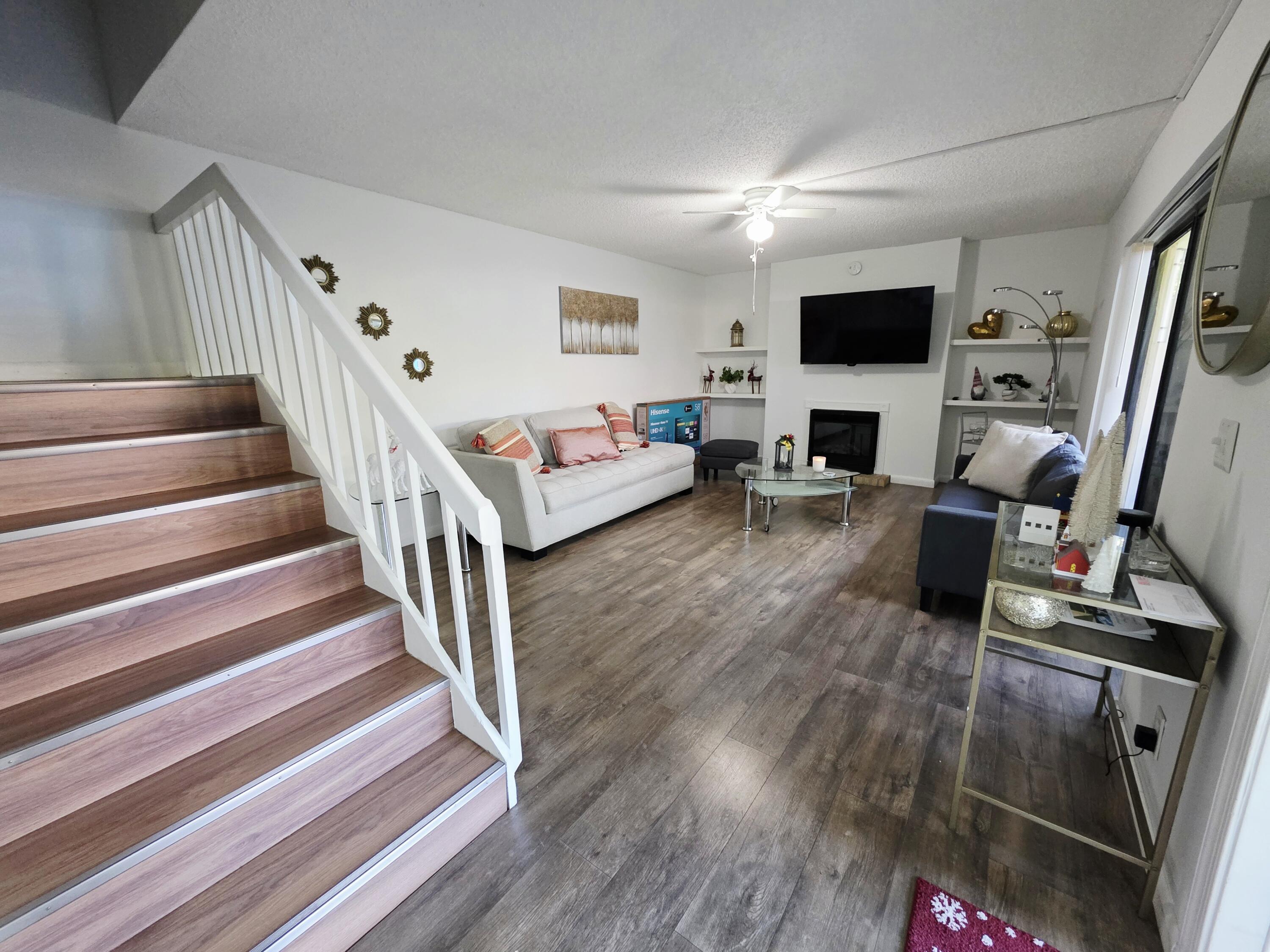 218 Woodland Road Palm Springs, FL 33461 - Photo 3 of 45 a living room with furniture and a flat screen tv