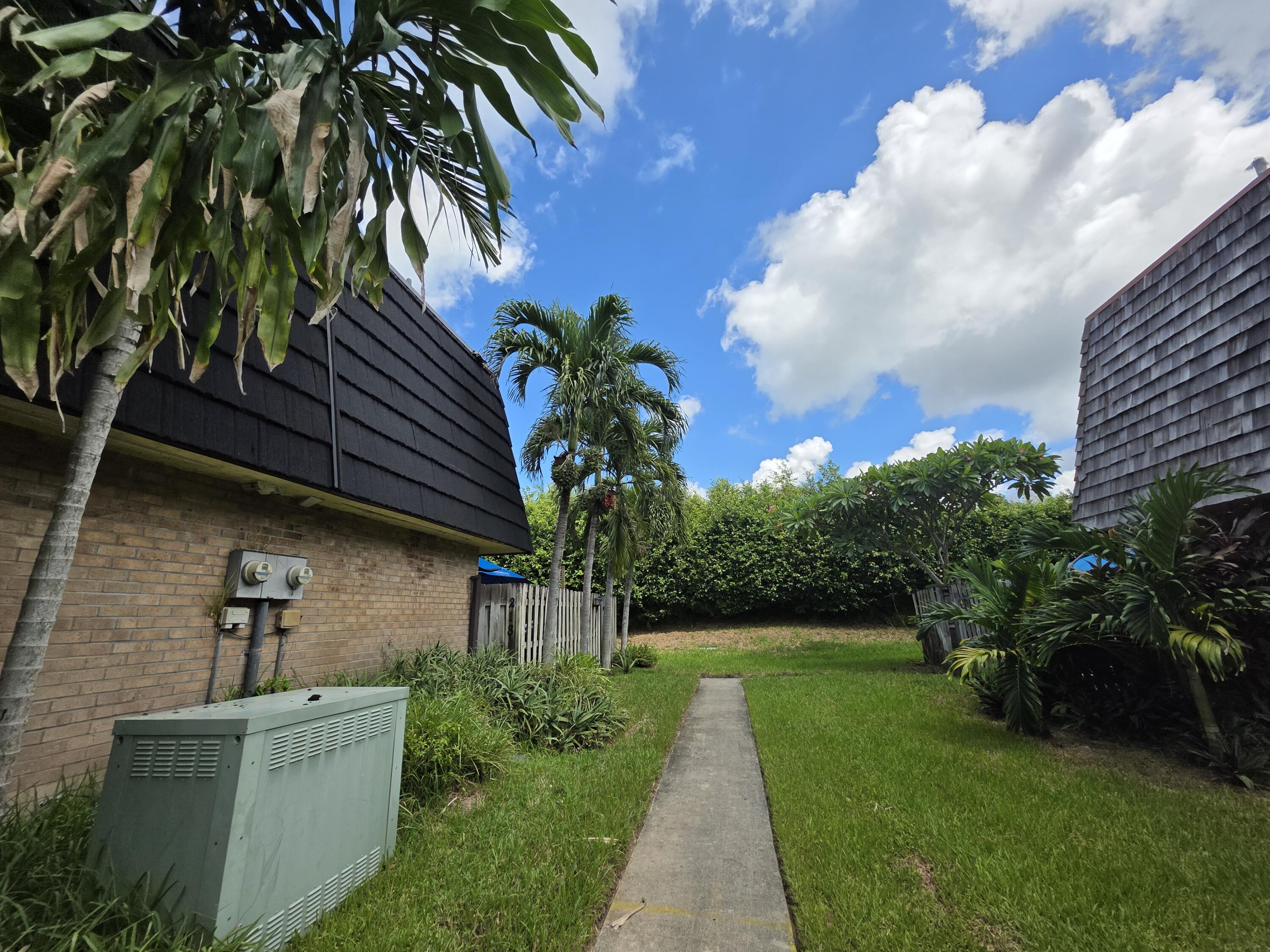 218 Woodland Road Palm Springs, FL 33461 - Photo 33 of 45 a view of a house with a yard