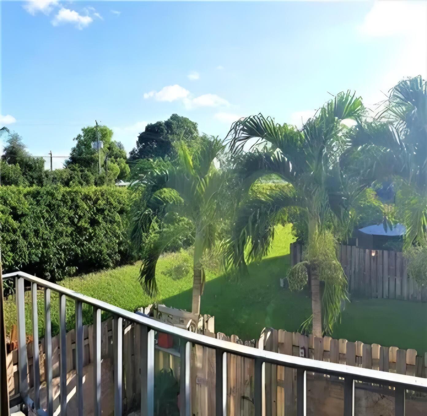 218 Woodland Road Palm Springs, FL 33461 - Photo 35 of 45 a view of a balcony with lake view