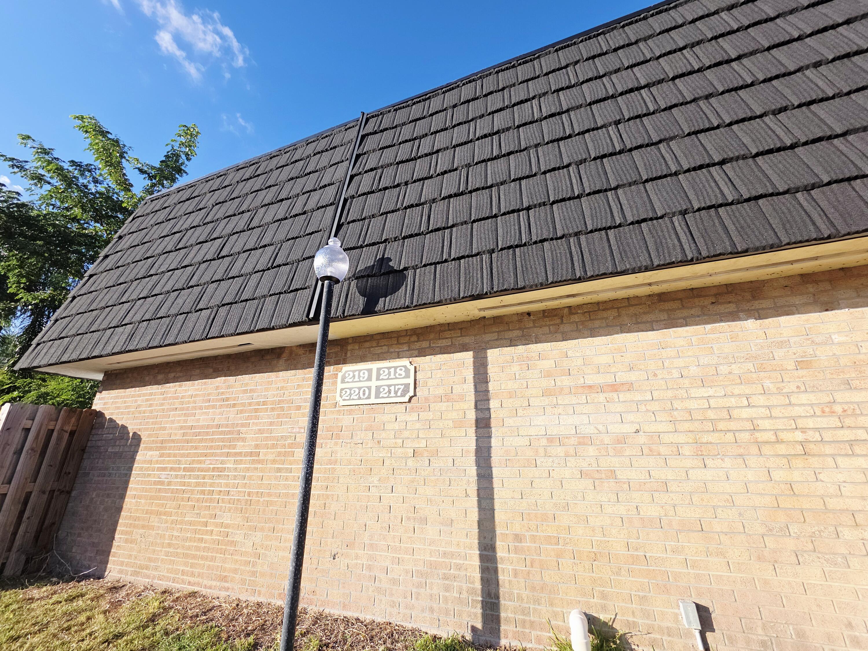 218 Woodland Road Palm Springs, FL 33461 - Photo 37 of 45 a roof deck with a backyard