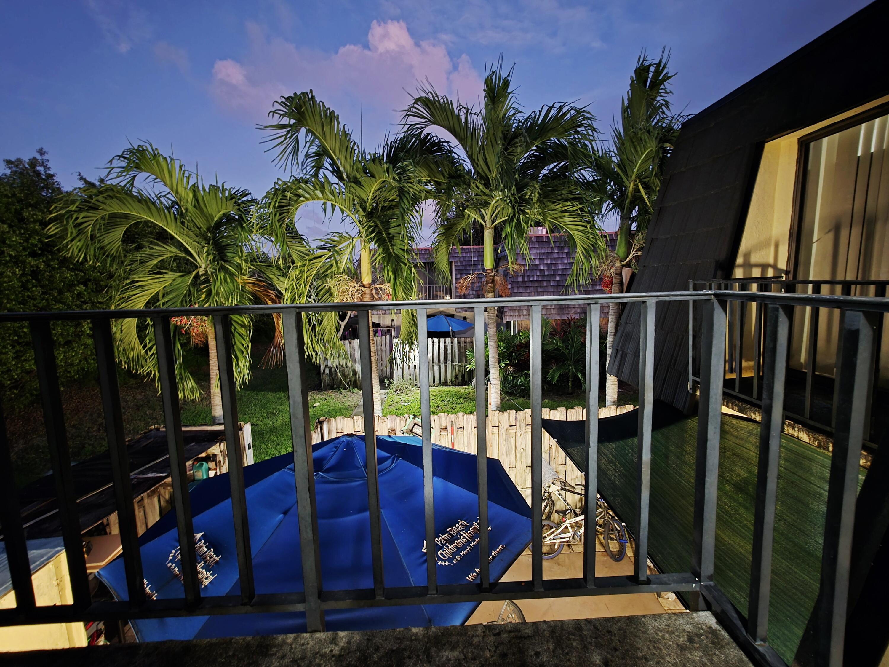 218 Woodland Road Palm Springs, FL 33461 - Photo 40 of 45 a view of a balcony with chairs