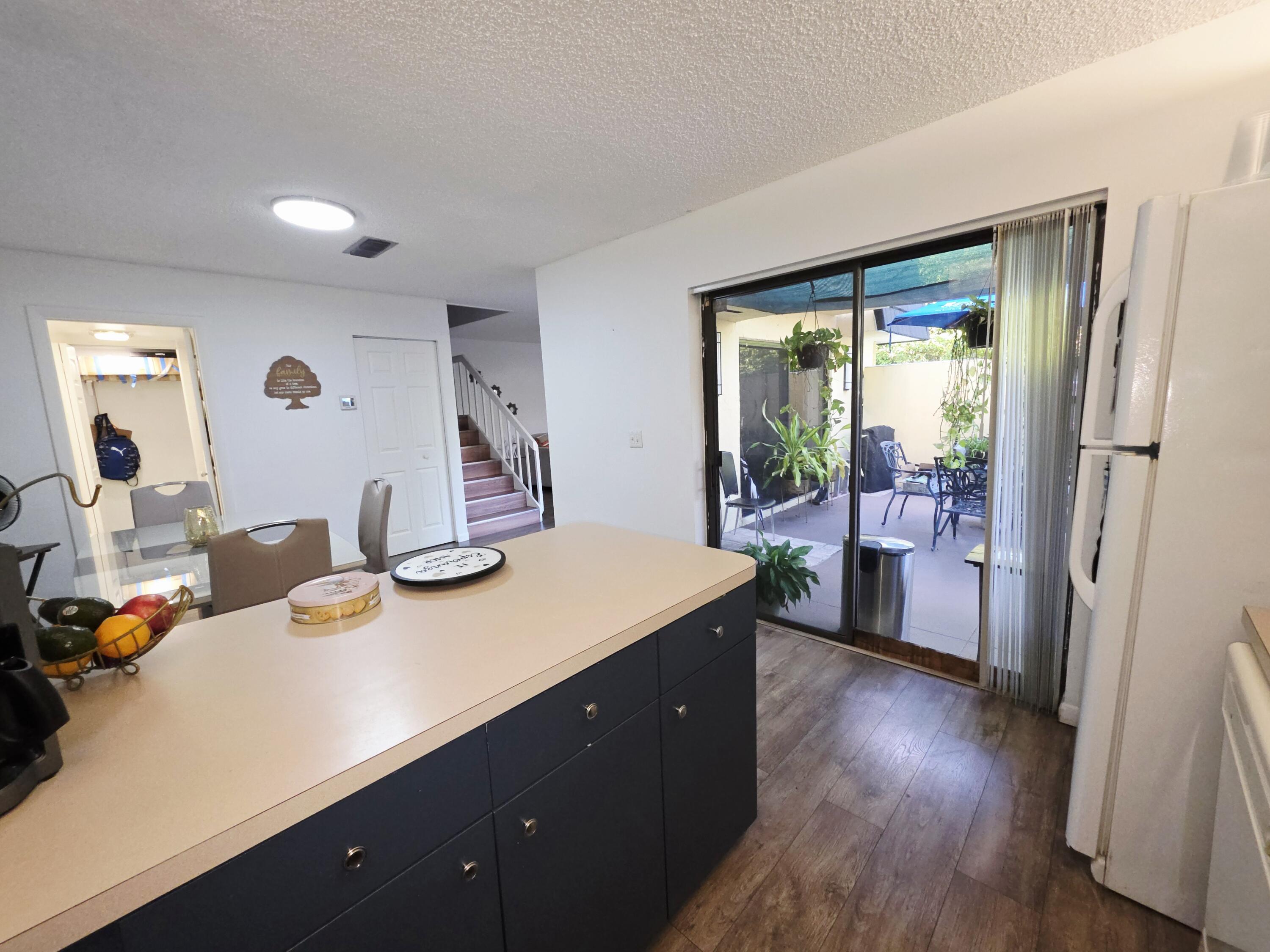 218 Woodland Road Palm Springs, FL 33461 - Photo 8 of 45 a room with a bed and a table