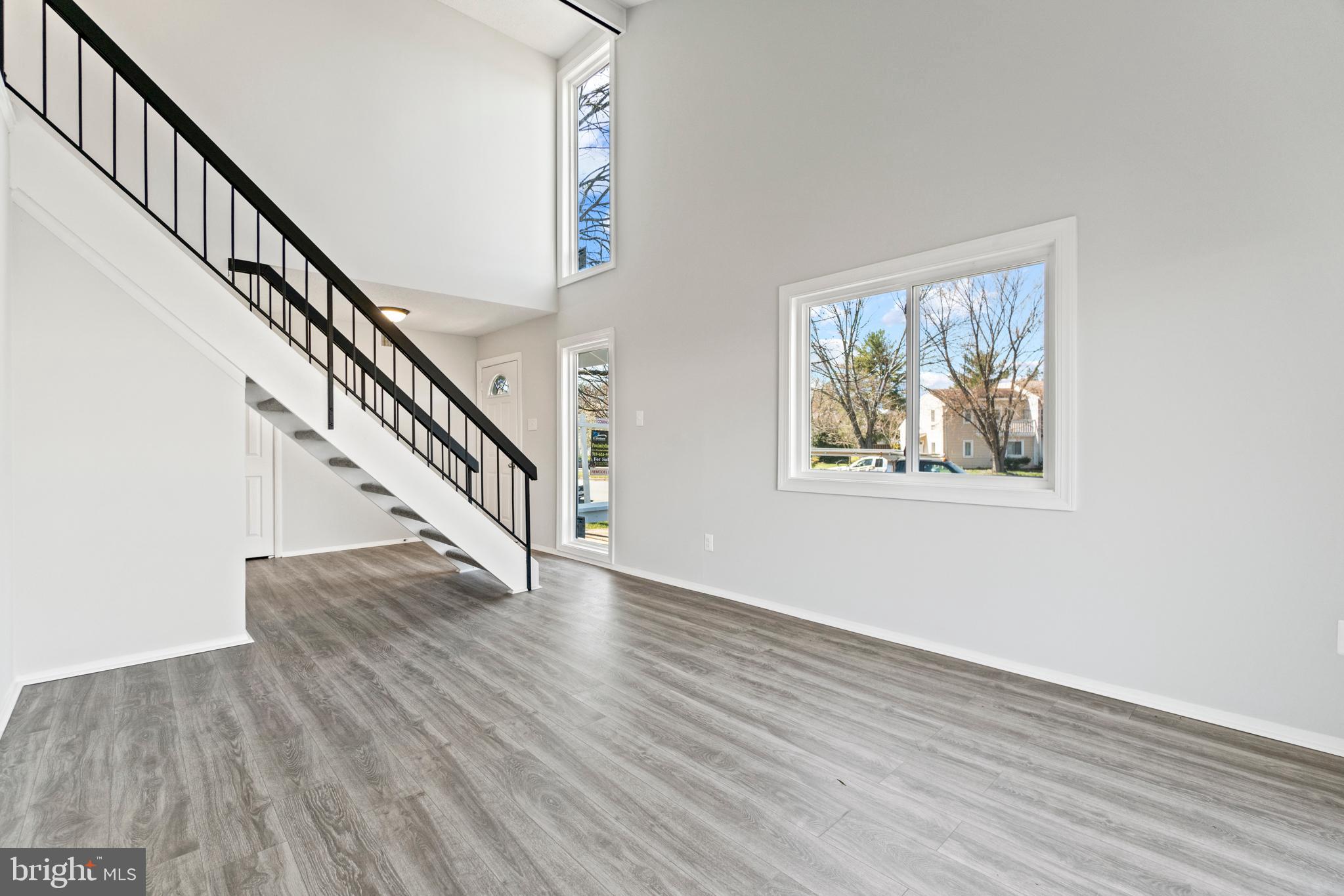 2 Regis Circle Sterling, VA 20164 - Photo 3 of 20 a view of staircase with wooden floor and stairs