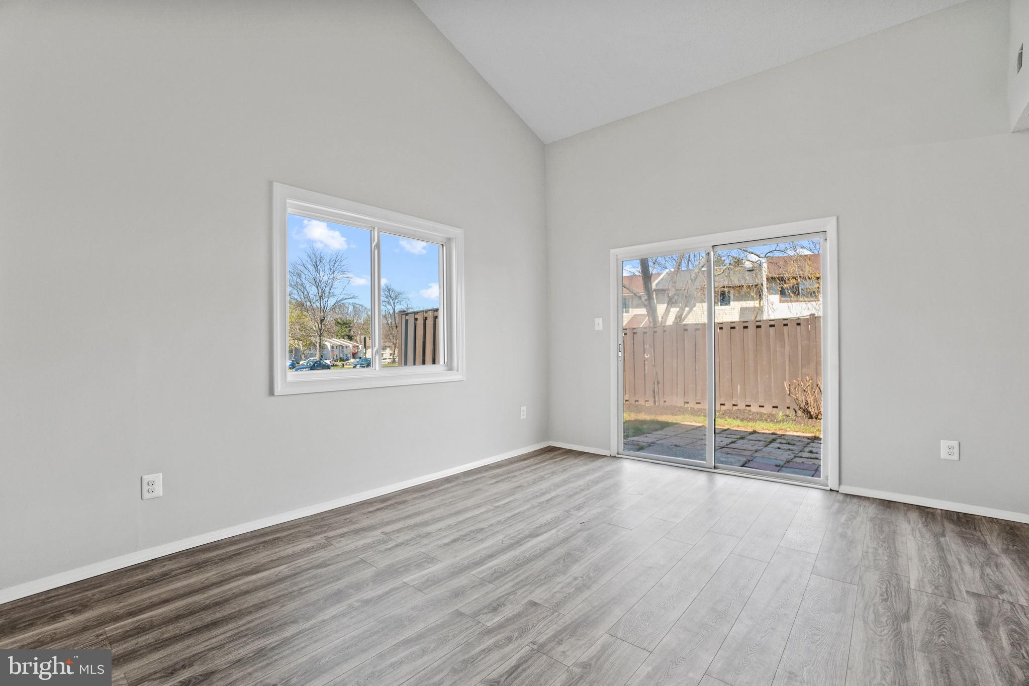 2 Regis Circle Sterling, VA 20164 - Photo 6 of 20 an empty room with wooden floor and windows