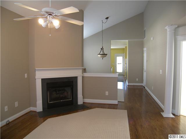 8307 Townley Road Huntersville, NC 28078 - Photo 3 of 16 a living room with furniture and a fireplace