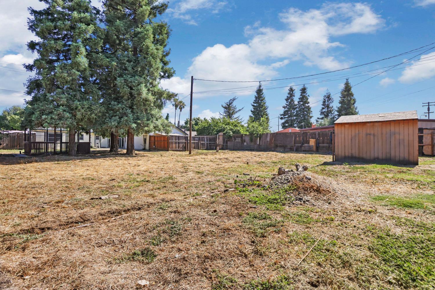 916 Elm Avenue Modesto, CA 95351 - Photo 29 of 52 30. Deep backyard view This yard has elbow room — space for play, planting, parking possibilities, or simply enjoying a little breathing room in town.