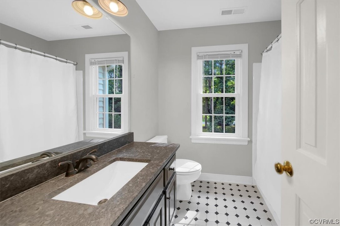 13230 Carters Way Road Chesterfield, VA 23838 - Photo 24 of 50 a bathroom with a sink a toilet a window and shower