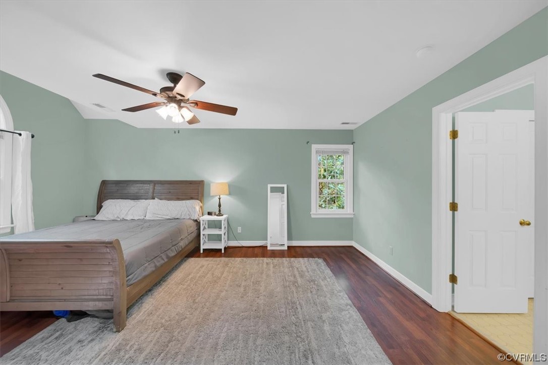 13230 Carters Way Road Chesterfield, VA 23838 - Photo 26 of 50 a bedroom with a large bed and a chandelier