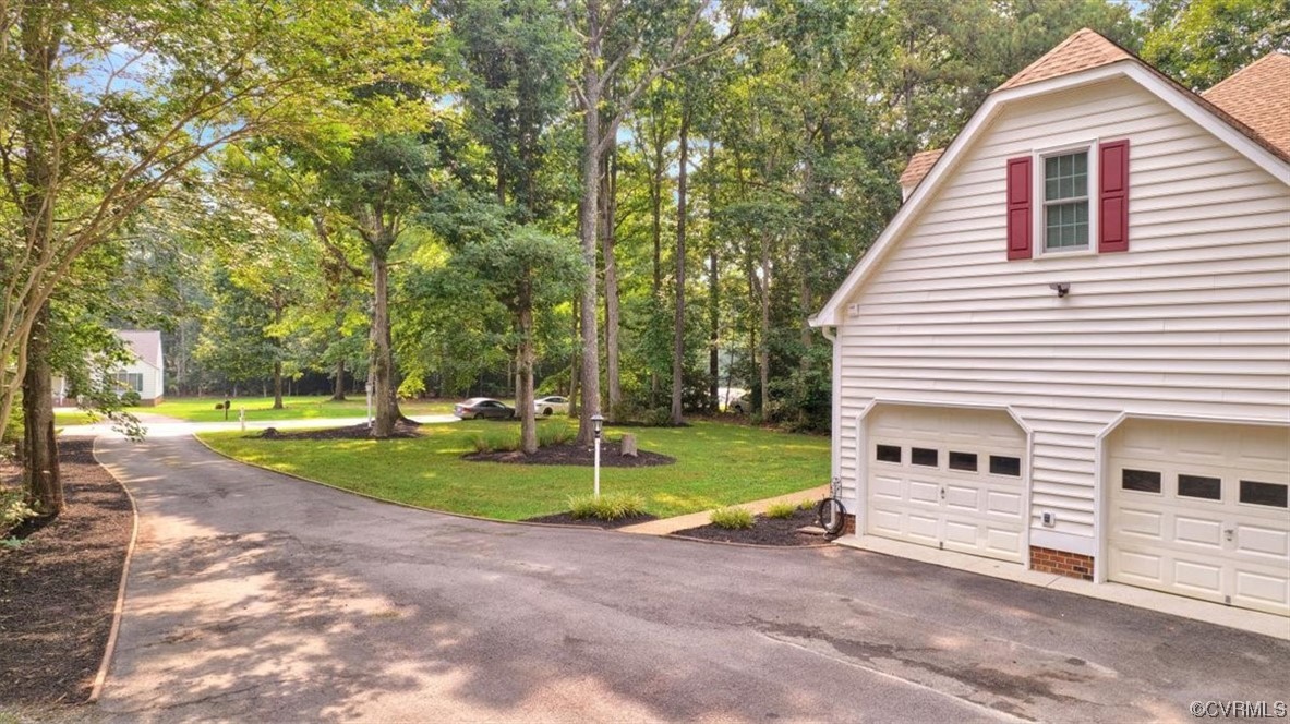 13230 Carters Way Road Chesterfield, VA 23838 - Photo 3 of 50 a view of a house with backyard and trees