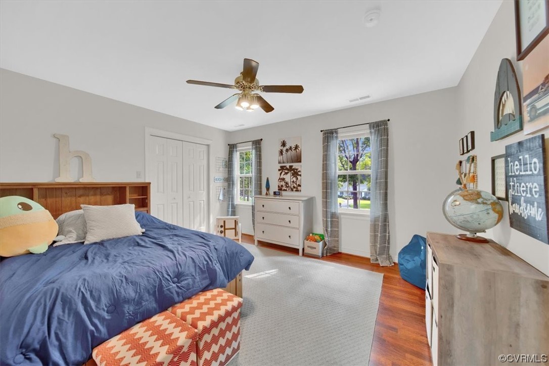 13230 Carters Way Road Chesterfield, VA 23838 - Photo 33 of 50 a bedroom with a large bed and a chandelier
