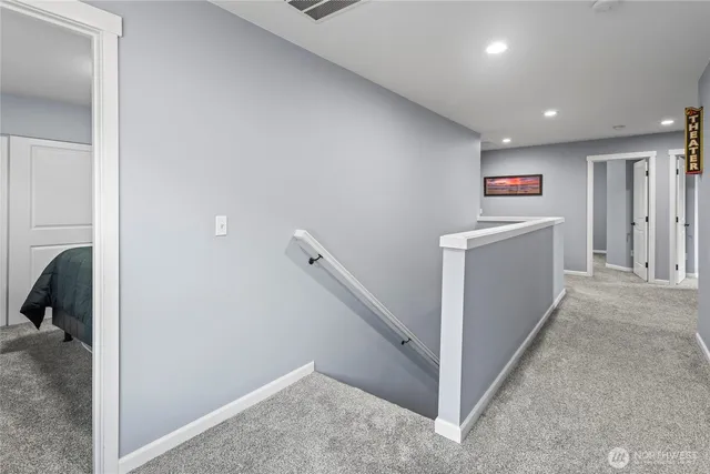 a view of a hallway with workspace and entryway