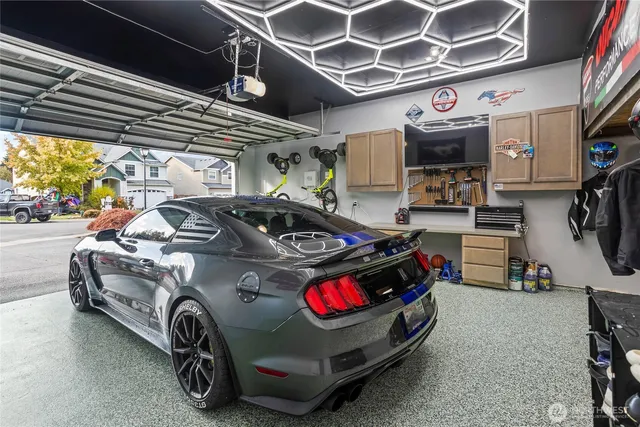 a car and bike parked in a garage