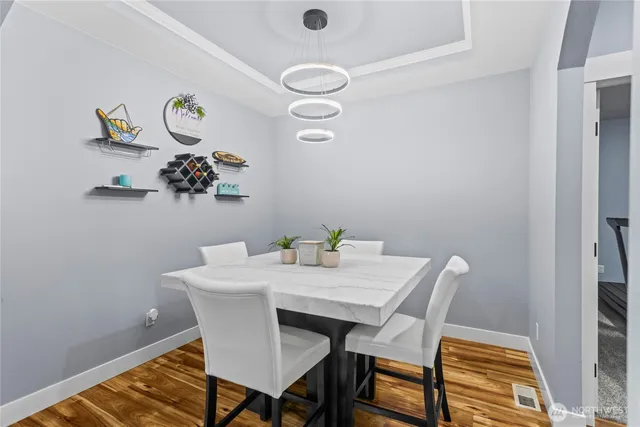 a view of a dining room that has a table and chair