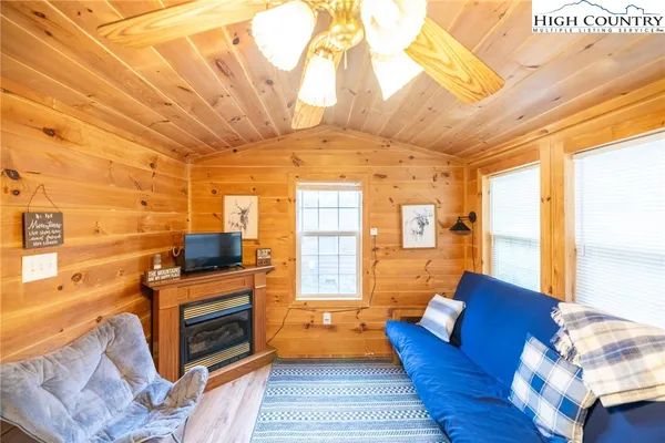 a living room with furniture a fireplace and a table
