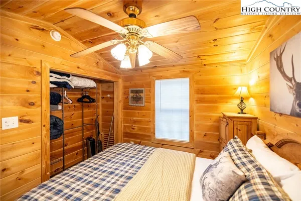 a bedroom with a bed and a walk in closet