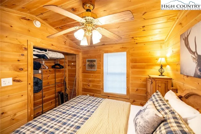 a bedroom with a bed and a walk in closet