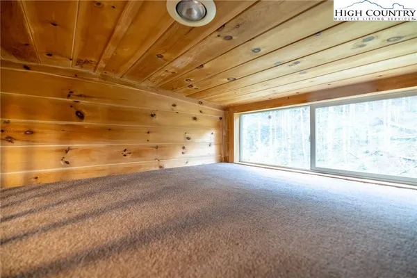 a view of empty room with windows