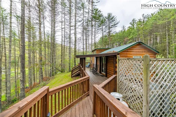 a view of a deck with wooden floor and outdoor space