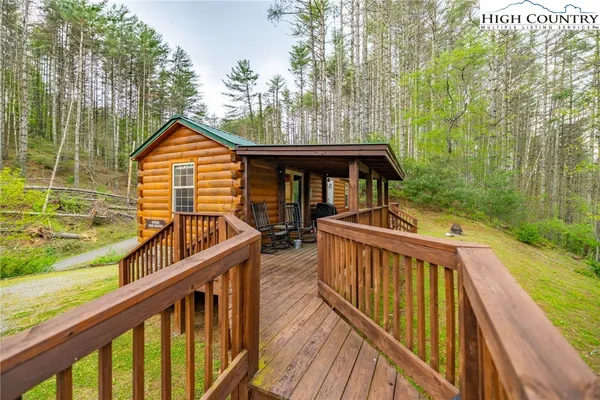 a view of house with a swimming pool