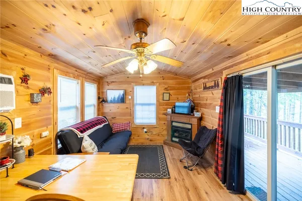 a bedroom with bed and a fireplace