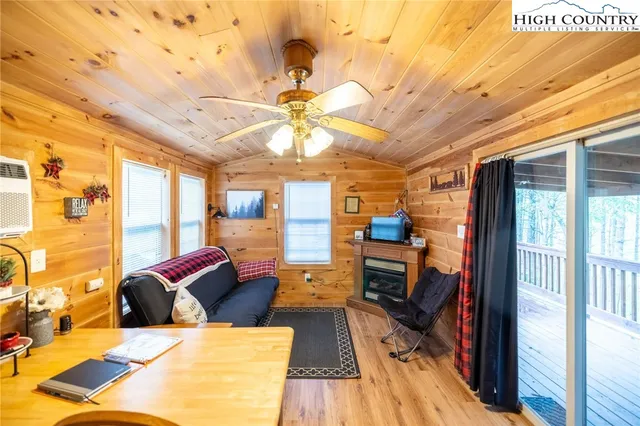 a bedroom with bed and a fireplace