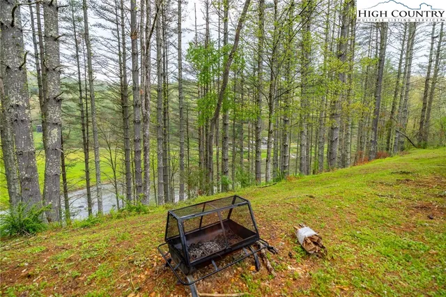 a view of backyard with swimming pool