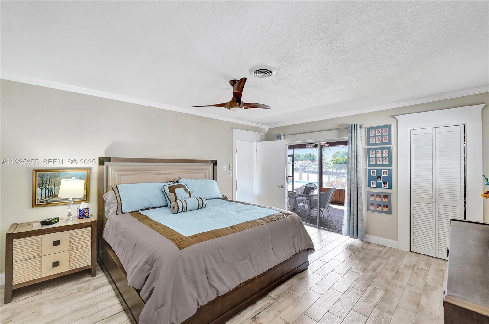 4060 Northeast 26th Avenue Lighthouse Point, FL 33064 - Photo 13 of 34 a bedroom with a large bed and a large window