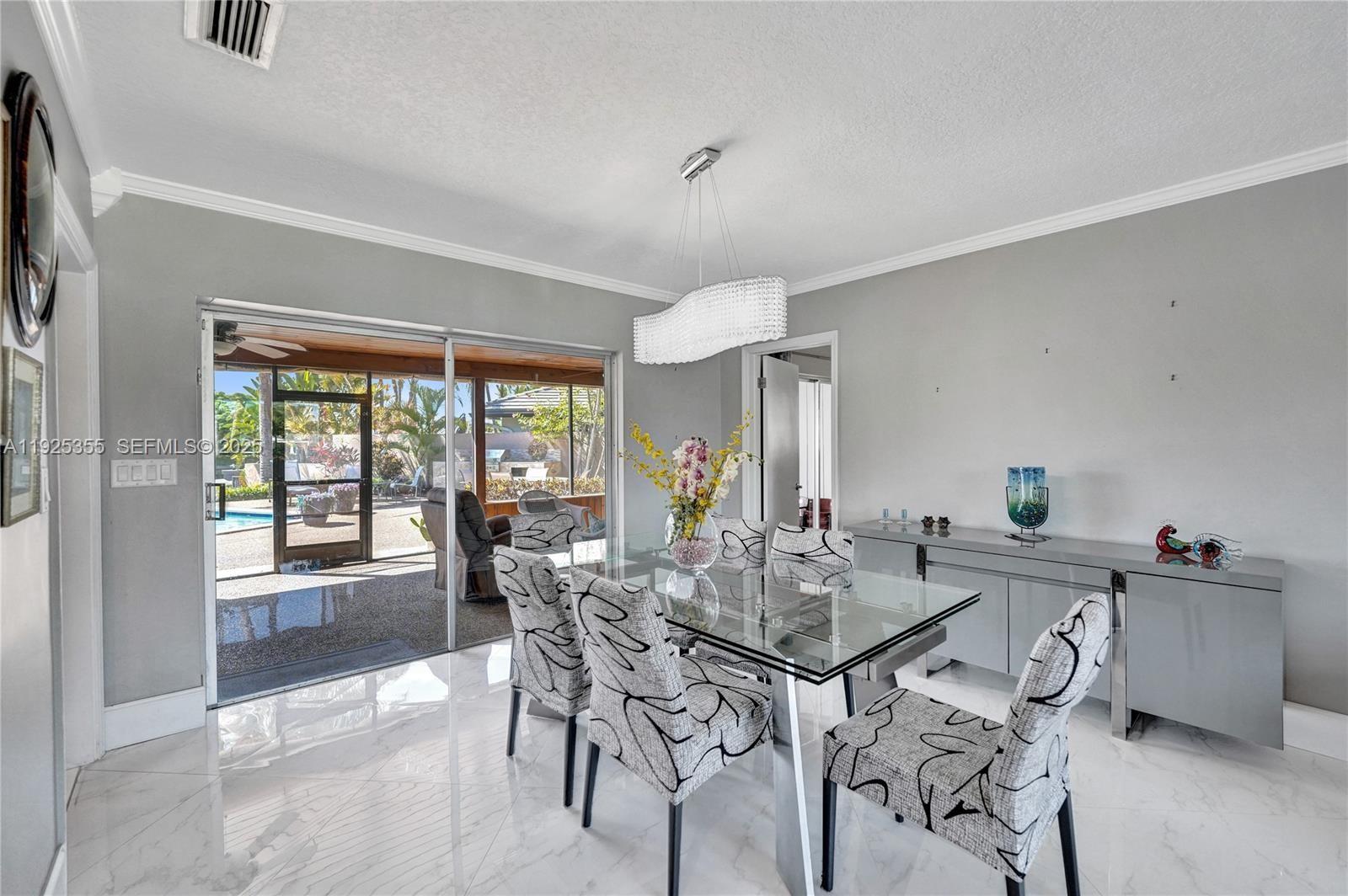4060 Northeast 26th Avenue Lighthouse Point, FL 33064 - Photo 17 of 34 a view of a dining room with furniture window and outside view