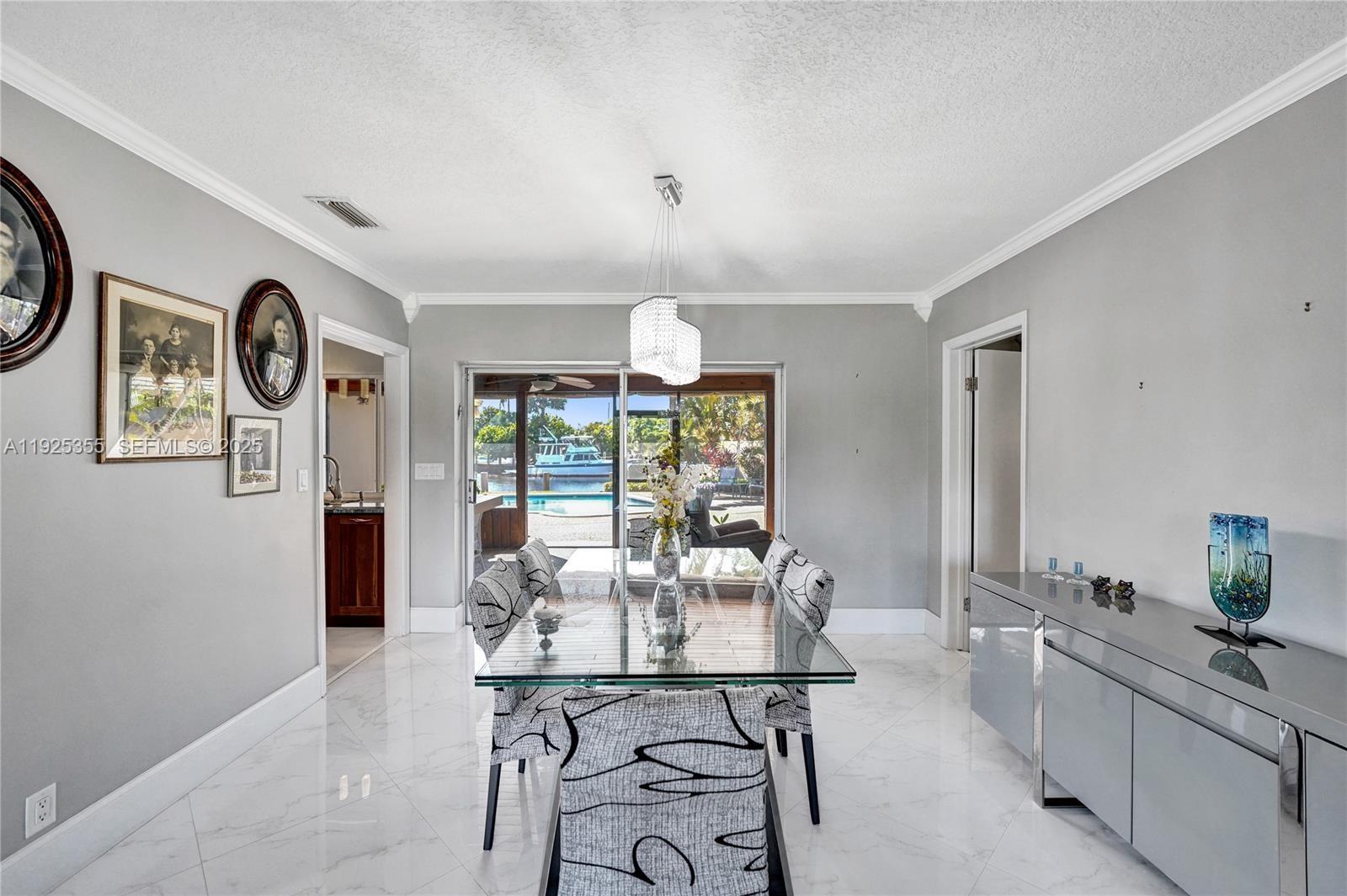 4060 Northeast 26th Avenue Lighthouse Point, FL 33064 - Photo 18 of 34 a view of a dining room with furniture window and outside view