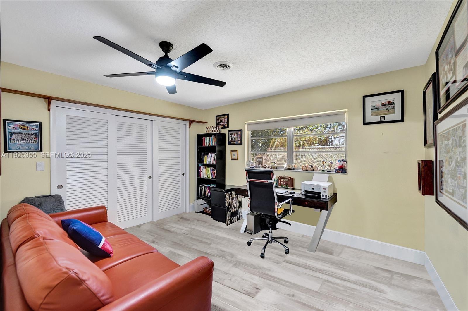4060 Northeast 26th Avenue Lighthouse Point, FL 33064 - Photo 21 of 34 a view of a livingroom with workspace and a window