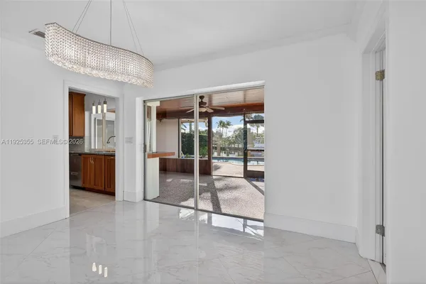 a view of an empty room with glass door