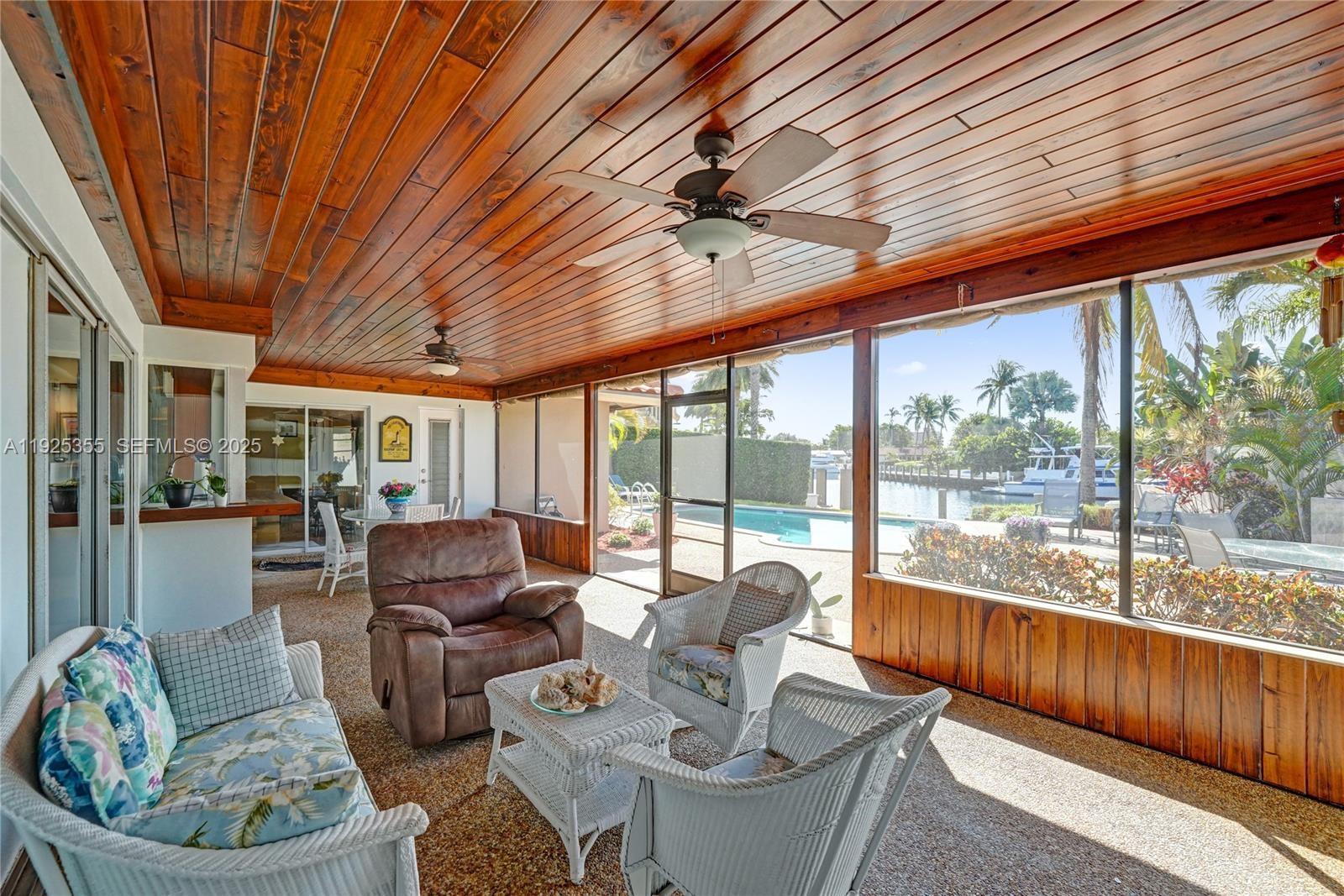 4060 Northeast 26th Avenue Lighthouse Point, FL 33064 - Photo 25 of 34 a living room with furniture and a large window