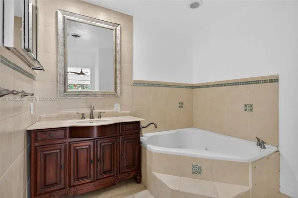 a bathroom with a window and a shower