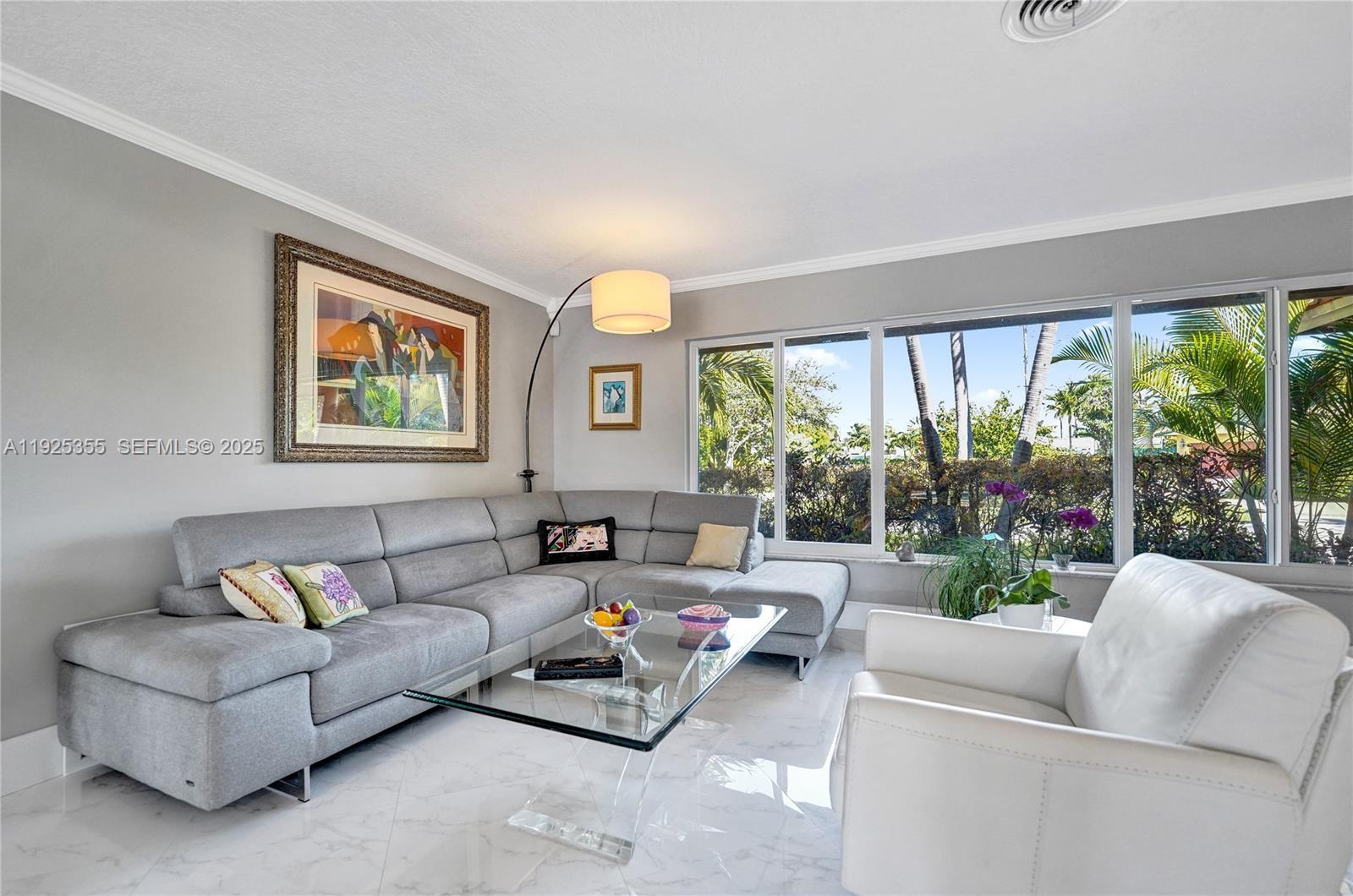 4060 Northeast 26th Avenue Lighthouse Point, FL 33064 - Photo 3 of 34 a living room with furniture and a large window