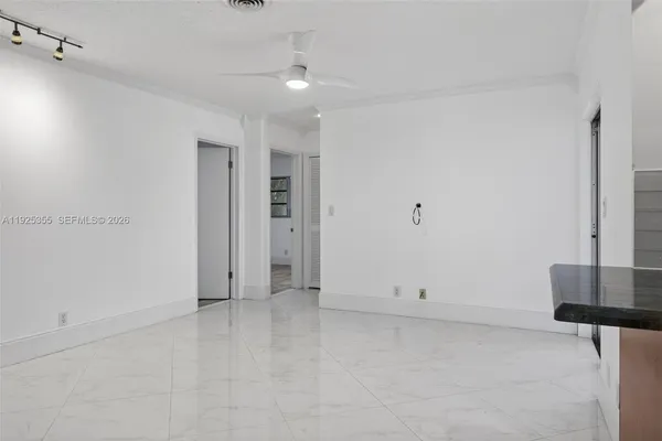 a view of living room and kitchen with furniture
