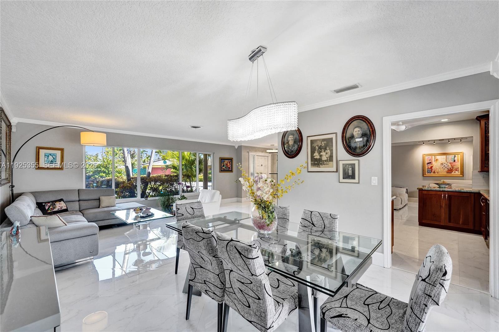 4060 Northeast 26th Avenue Lighthouse Point, FL 33064 - Photo 5 of 34 a living room with furniture and a large window
