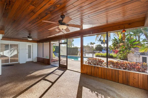 a view of a porch with wooden floor