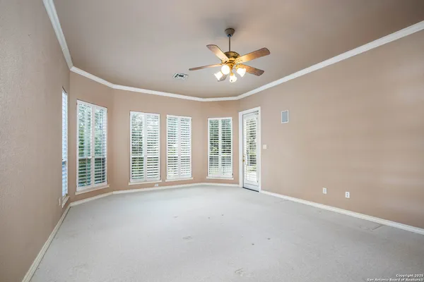 a view of an empty room with a window