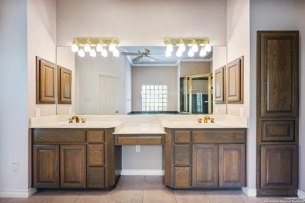 a bathroom with a sink double vanity and a mirror