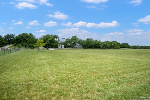a view of a lake with a yard