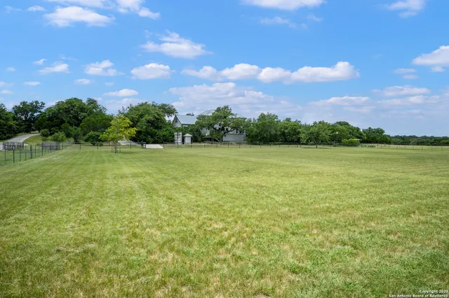a view of a lake with a yard