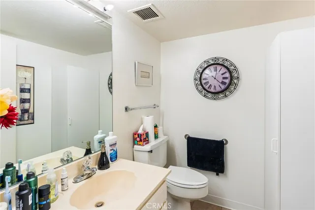 a bathroom with a toilet and a sink