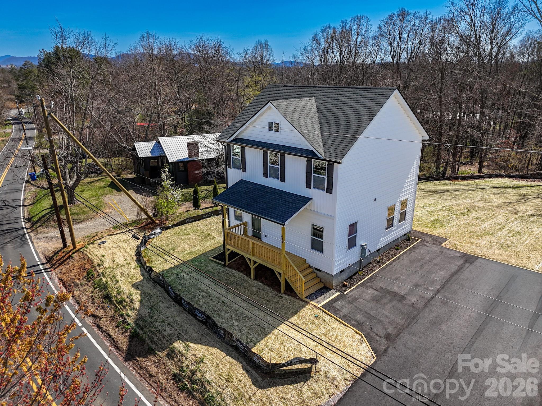 424 Hazel Mill Road Asheville, NC 28806 - Photo 2 of 47 a front view of a house with a yard