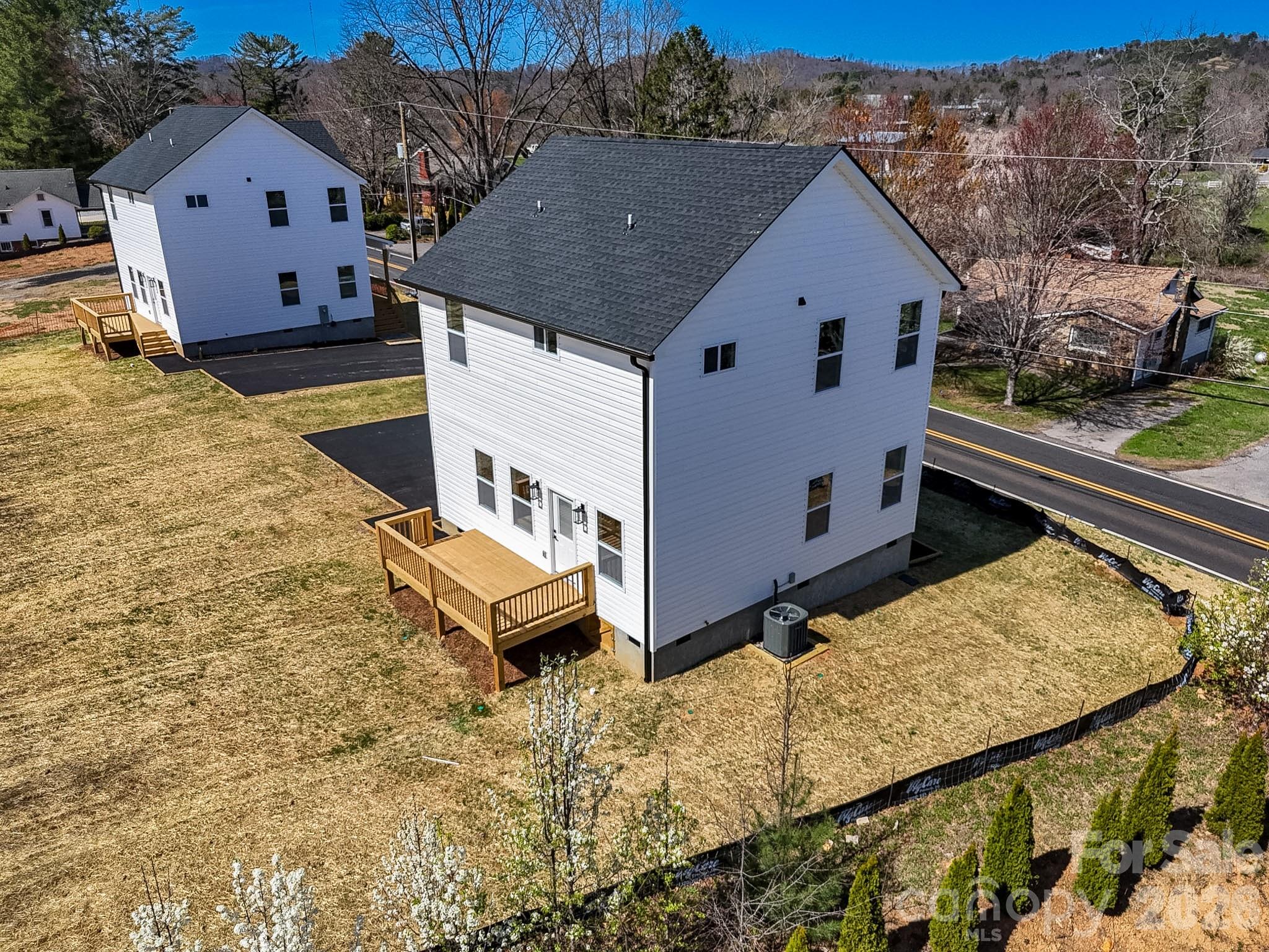 424 Hazel Mill Road Asheville, NC 28806 - Photo 3 of 47 a aerial view of a house with large trees