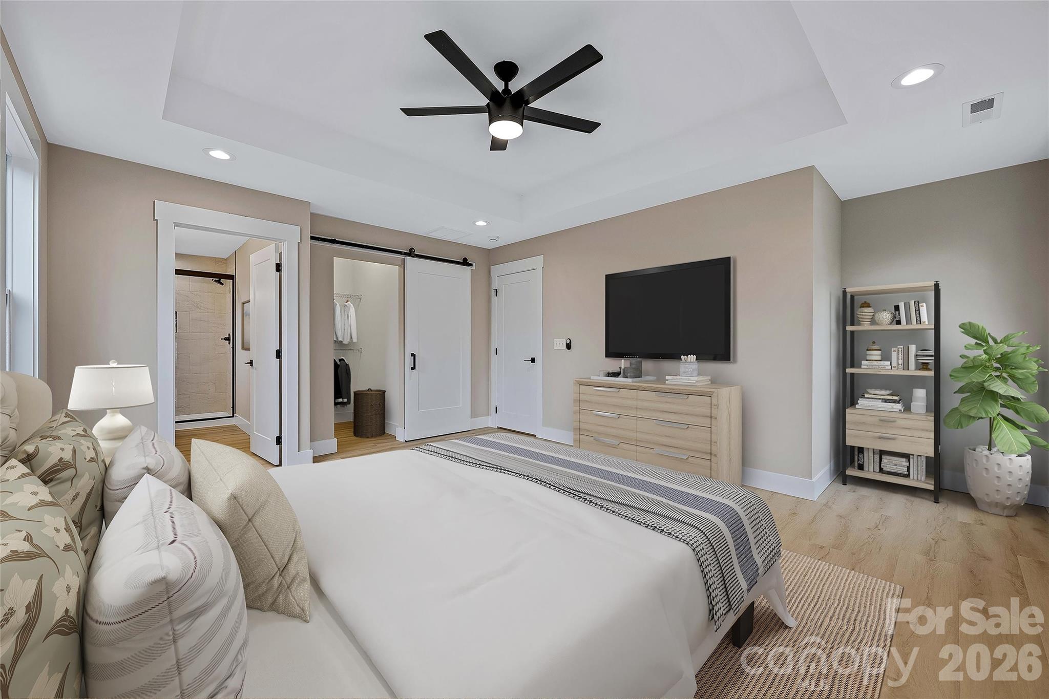 424 Hazel Mill Road Asheville, NC 28806 - Photo 32 of 47 a bedroom with a bed tv and a window