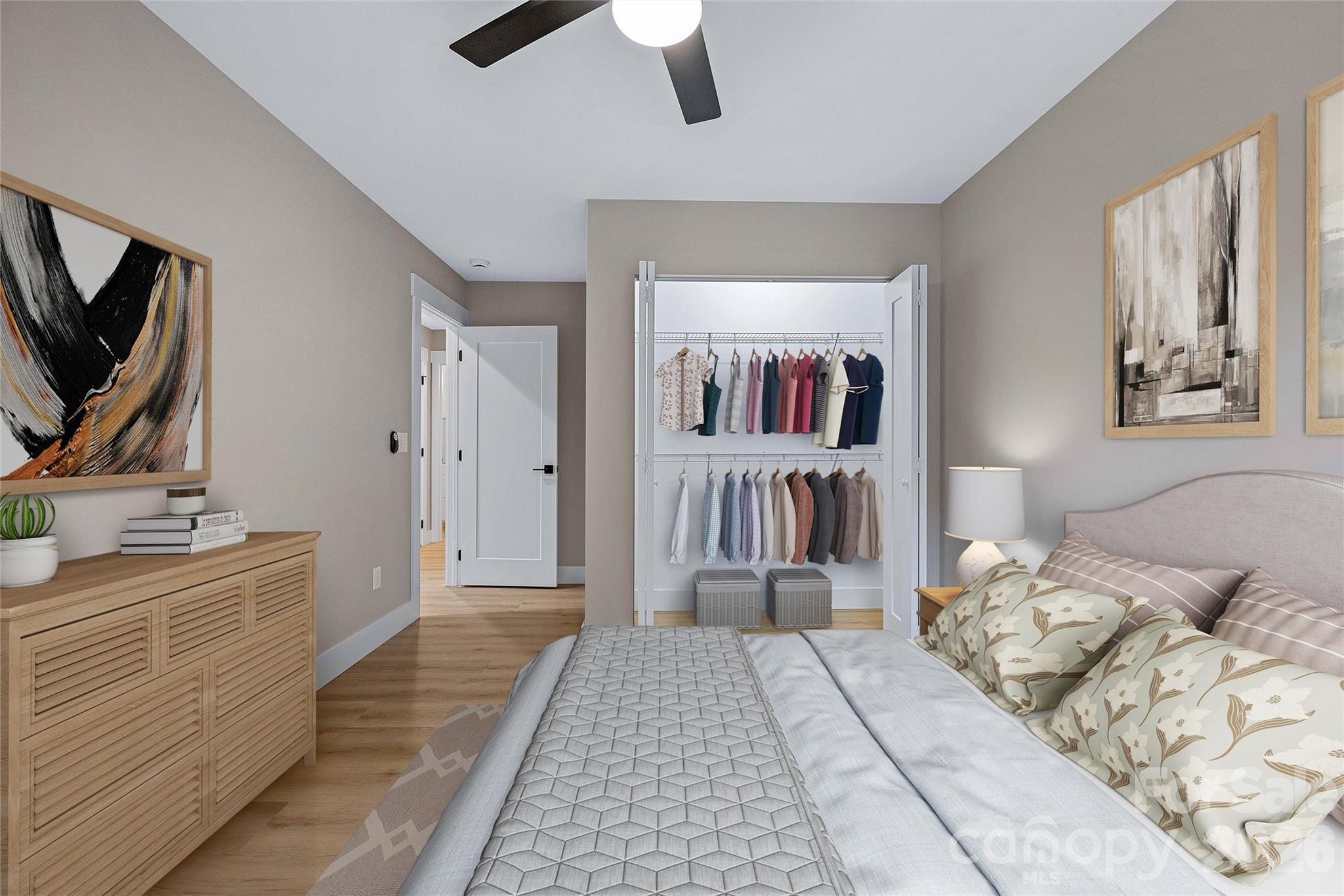 424 Hazel Mill Road Asheville, NC 28806 - Photo 39 of 47 a bedroom with a large bed a flat tv screen and a book shelf