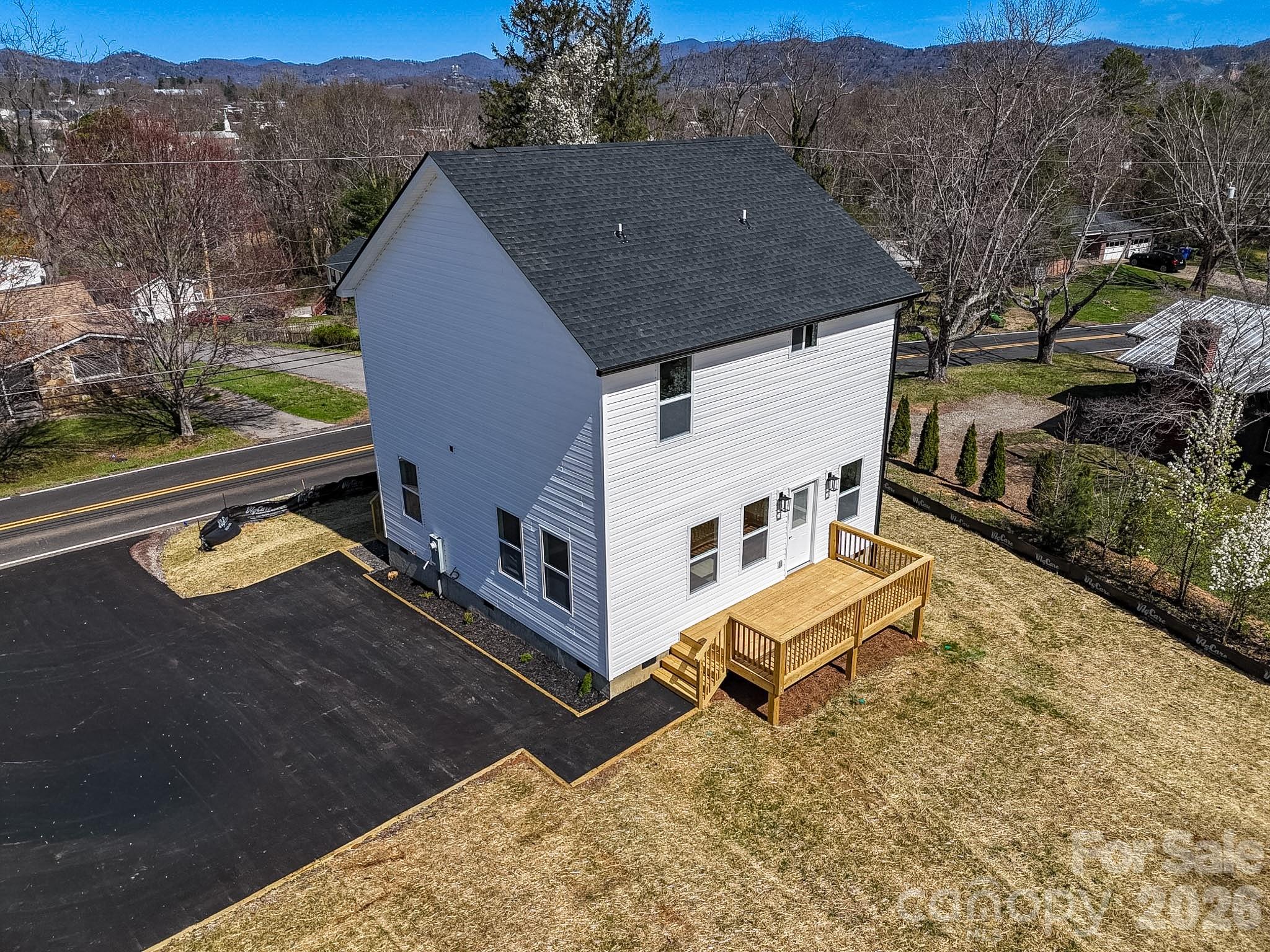 424 Hazel Mill Road Asheville, NC 28806 - Photo 4 of 47 a aerial view of a house with a yard and sitting area